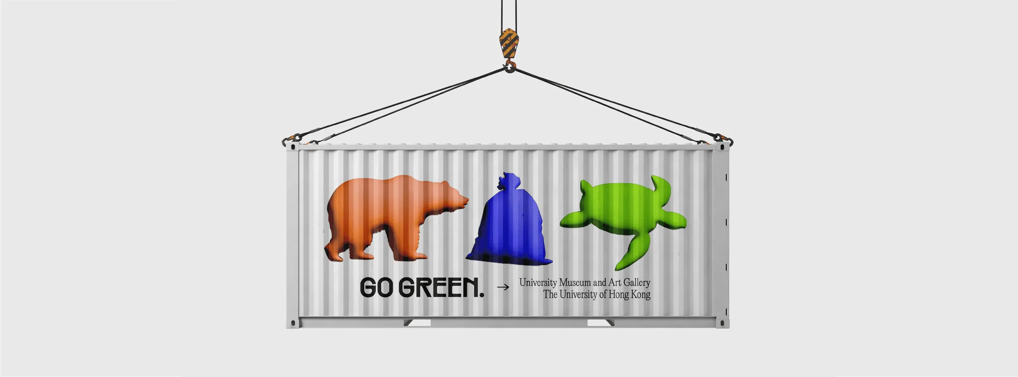 A shipping container hanging from a crane, printed with the bear, bag and turtle and GO GREEN. → University Museum and Art Gallery, on paper