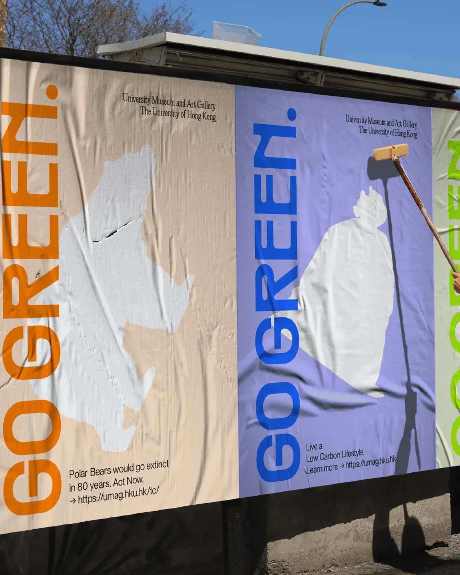 Street billboards being wheat-pasted with GO GREEN. posters in orange, blue and green, "Polar bears would go extinct in 80 years. Act now."