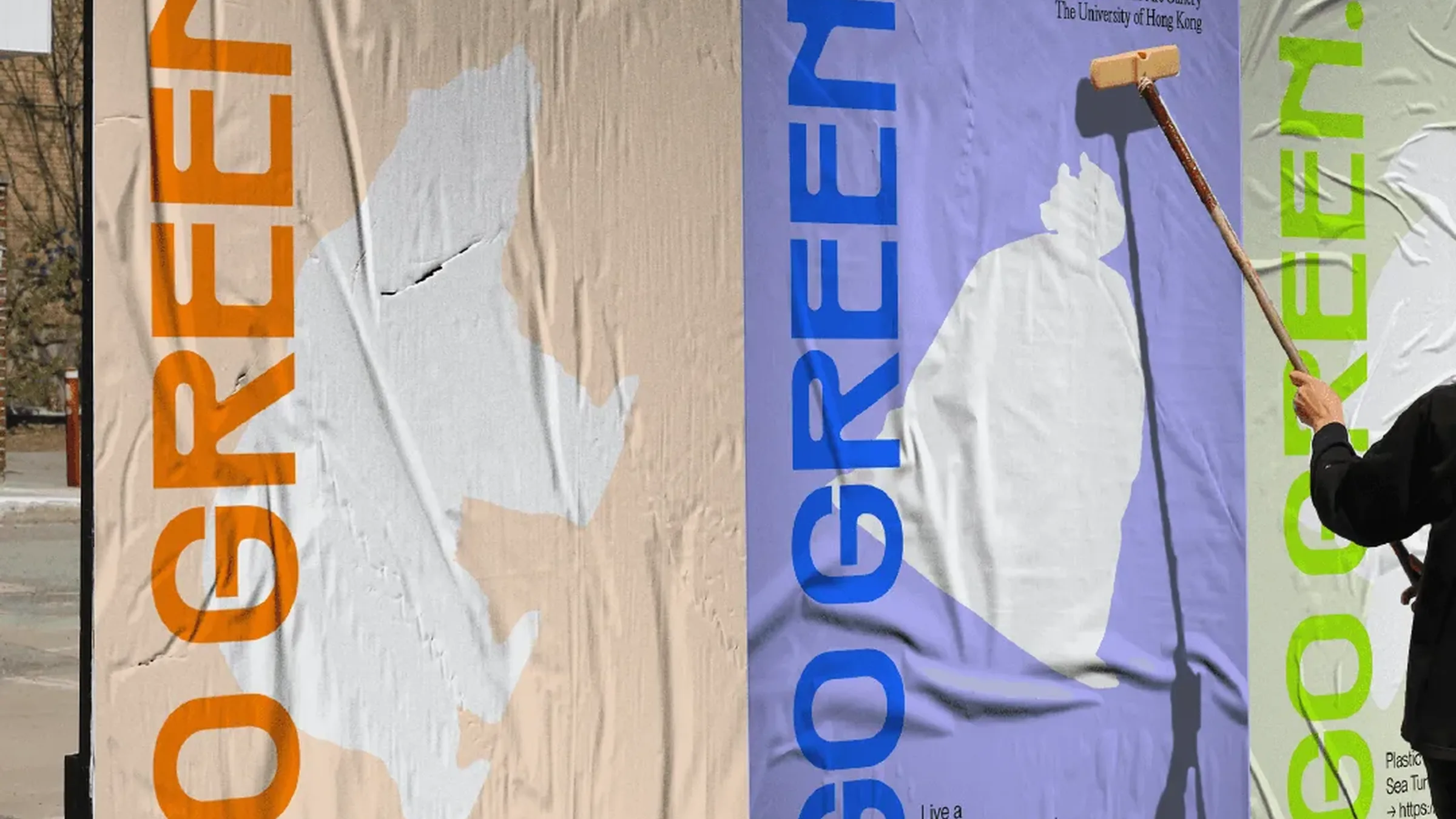 Street billboards being wheat-pasted with GO GREEN. posters in orange, blue and green, "Polar bears would go extinct in 80 years. Act now."