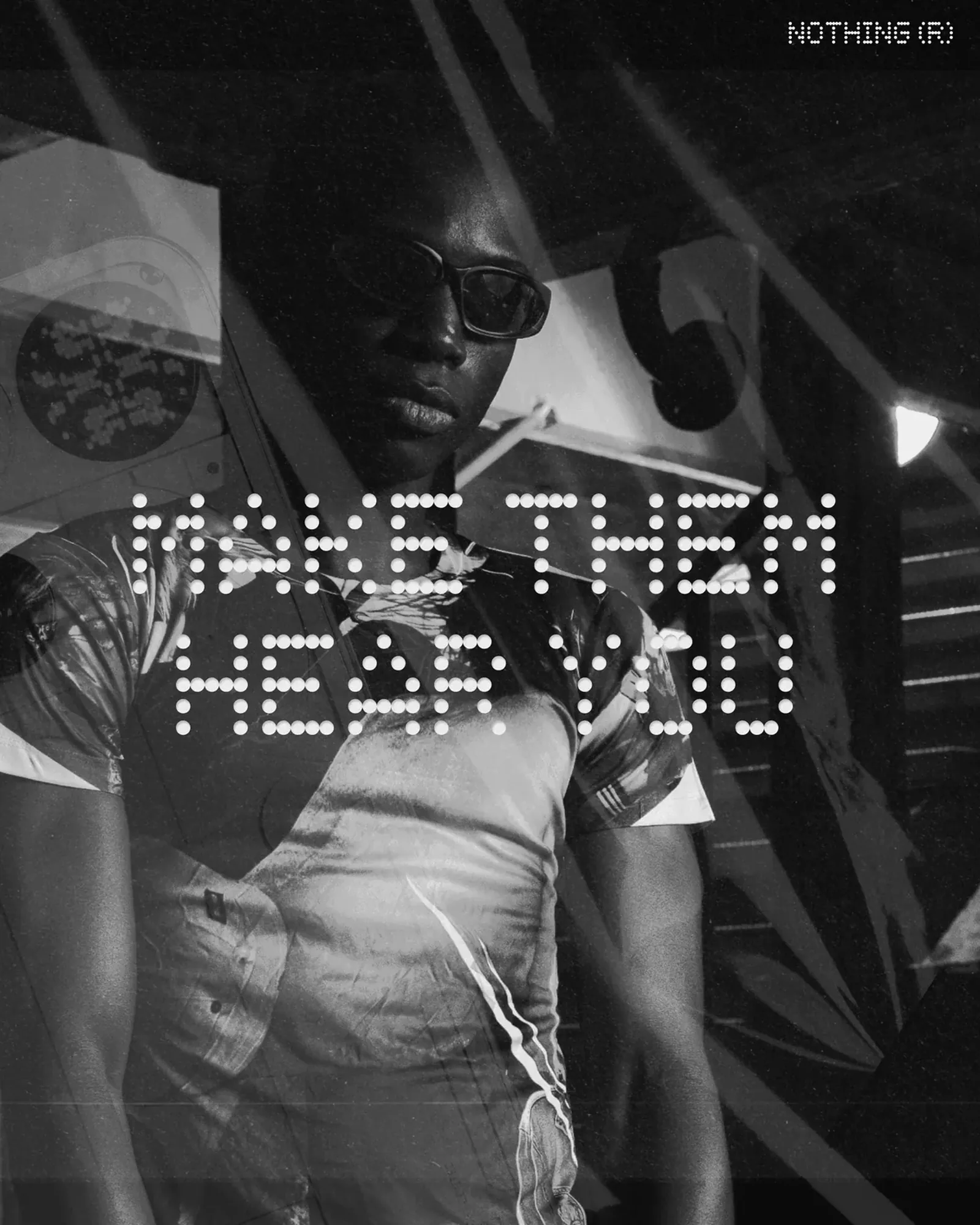 Make Them Hear You: a grainy black-and-white portrait of a man in sunglasses layered over speaker hardware, the line set in Nothing's white dot-matrix type