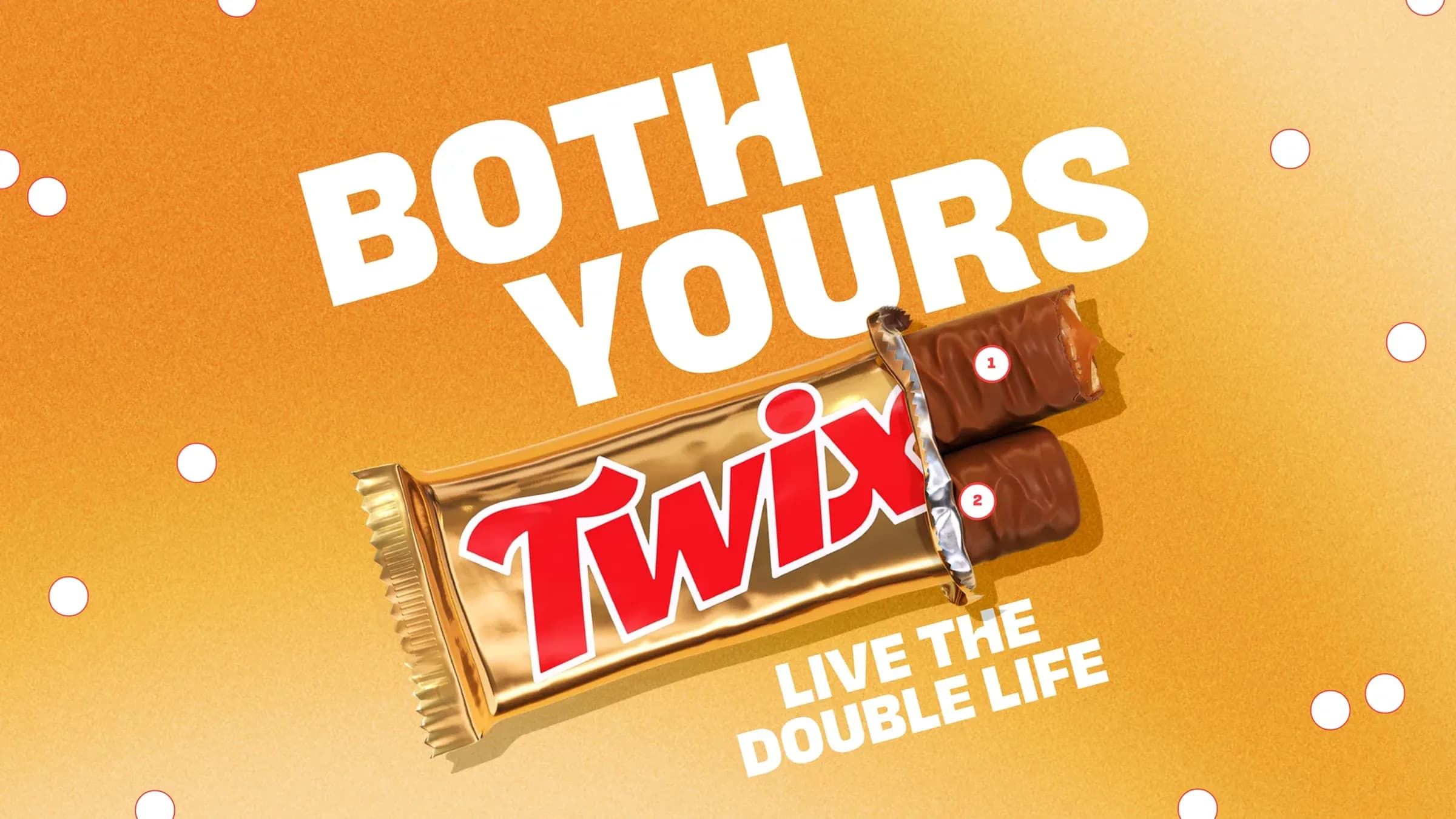 An opened gold Twix wrapper with the two bars numbered 1 and 2, under BOTH YOURS and LIVE THE DOUBLE LIFE on orange