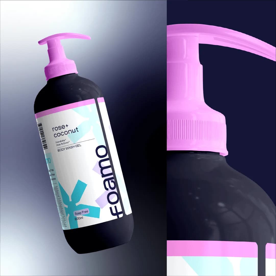 The rose + coconut bottle floating beside a close-up of its pink pump, on paper