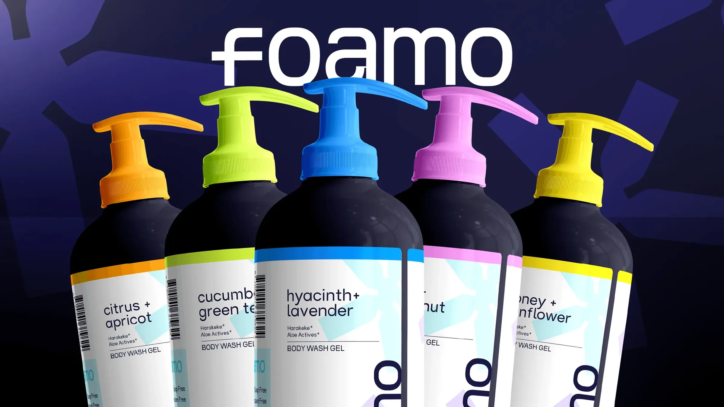 The white foamo wordmark above five dark body wash bottles with orange, lime, blue, pink and yellow pumps, on deep indigo