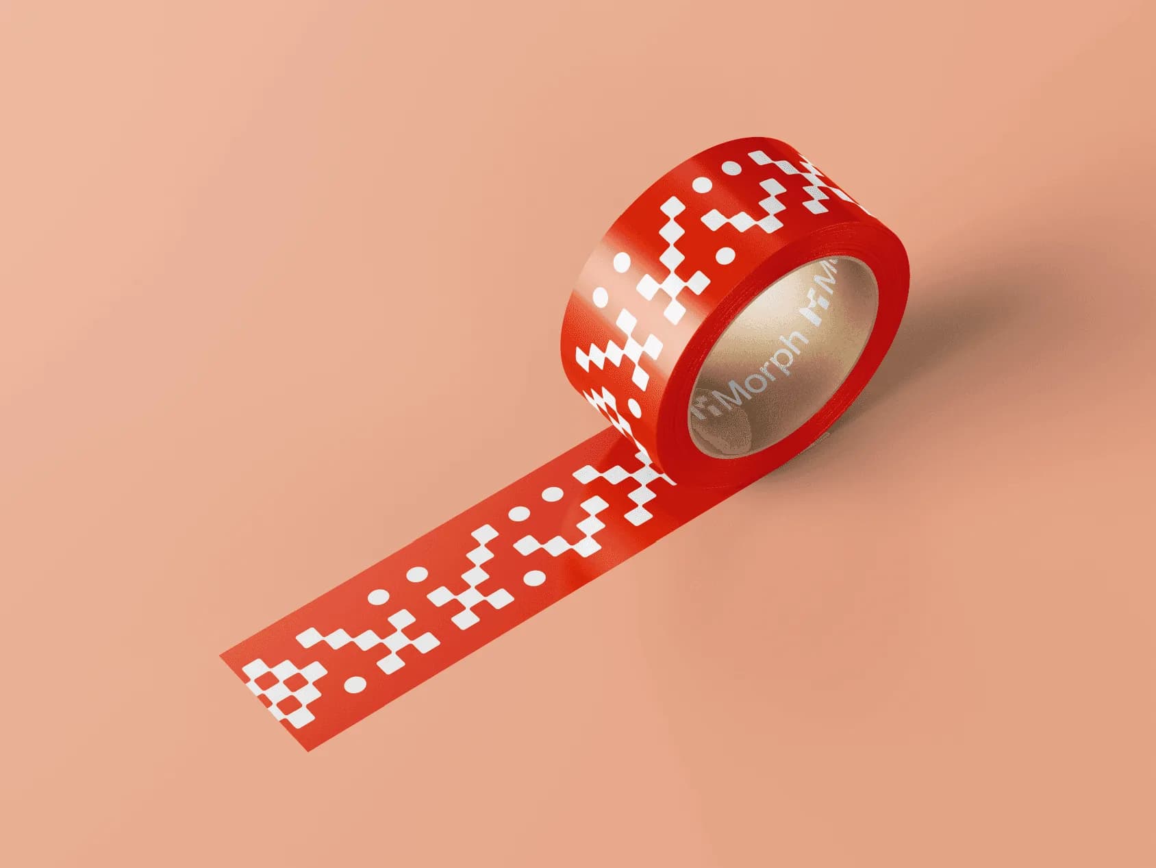 A roll of red Morph packing tape printed with white pixel shapes and the logo, on salmon